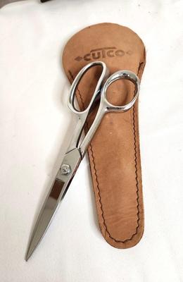 Lot #95 Lot of 3 Implements - CUTCO Scissors in Case, CUTCO slotted spoon, and American Royalty Serrated Knife
