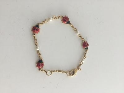 Gold tone lady bug fashion bracelet