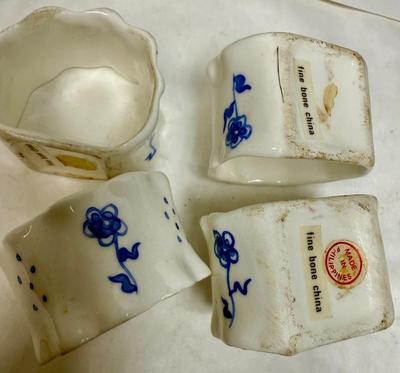 Sale Photo Thumbnail #217: Includes a vintage WWII era US Navy Mess Plate, a tile trivet, cups, napkin rings, cup & saucer, small flower pot, and a small duck figurine.