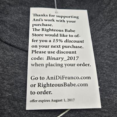 LOT 11: New in Sealed Plastic Signed Ani Di Franco Album, T-Shirt, and Lyrics Booklet