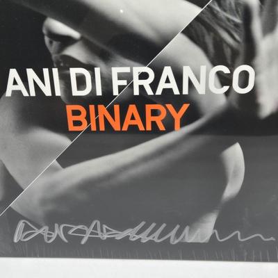 LOT 11: New in Sealed Plastic Signed Ani Di Franco Album, T-Shirt, and Lyrics Booklet