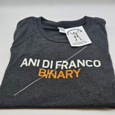 LOT 11: New in Sealed Plastic Signed Ani Di Franco Album, T-Shirt, and Lyrics Booklet