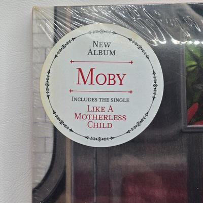LOT 17: New in Sealed Plastic The Prodigy The Day is My Enemy, Moby Everything was Beautiful and Nothing Hurt, and Unsealed Level 42...