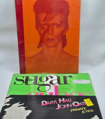 LOT 20: New in Sealed Plastic David Bowie is in Here , and Unsealed Daryl Hall and John Oates Private Eyes , and The Sugar Cubes...