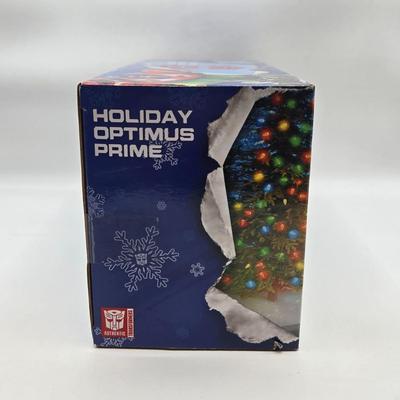 LOT 43: NIB Holiday Optimus Prime and Transformers Dark of the Moon Mechtech Weapons System
