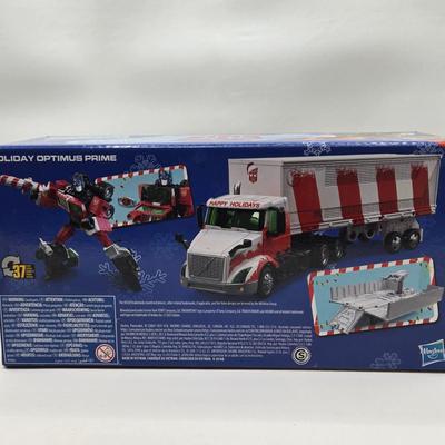 LOT 43: NIB Holiday Optimus Prime and Transformers Dark of the Moon Mechtech Weapons System