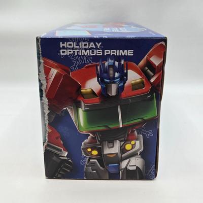 LOT 43: NIB Holiday Optimus Prime and Transformers Dark of the Moon Mechtech Weapons System