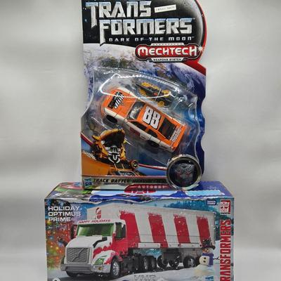 LOT 43: NIB Holiday Optimus Prime and Transformers Dark of the Moon Mechtech Weapons System