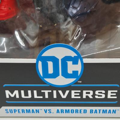LOT 79: 2 Sets of DC Multiverse Superman vs. Batman NIB