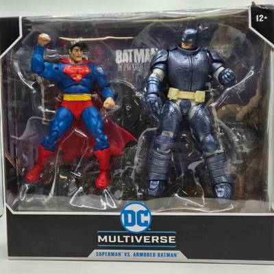 LOT 79: 2 Sets of DC Multiverse Superman vs. Batman NIB