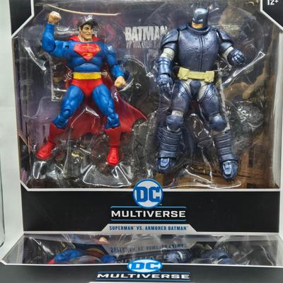 LOT 79: 2 Sets of DC Multiverse Superman vs. Batman NIB