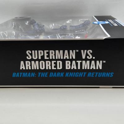 LOT 79: 2 Sets of DC Multiverse Superman vs. Batman NIB