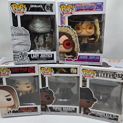 LOT 122: NIB Funko Pops Including Iggy Pop, Tupac Shakur, Notorious B.I.G., Janis Joplin , and Metallica Lady Justice