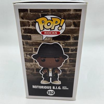 LOT 122: NIB Funko Pops Including Iggy Pop, Tupac Shakur, Notorious B.I.G., Janis Joplin , and Metallica Lady Justice