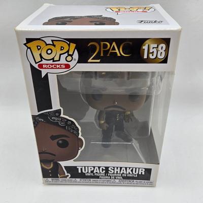 LOT 122: NIB Funko Pops Including Iggy Pop, Tupac Shakur, Notorious B.I.G., Janis Joplin , and Metallica Lady Justice