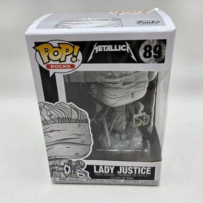 LOT 122: NIB Funko Pops Including Iggy Pop, Tupac Shakur, Notorious B.I.G., Janis Joplin , and Metallica Lady Justice