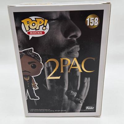 LOT 122: NIB Funko Pops Including Iggy Pop, Tupac Shakur, Notorious B.I.G., Janis Joplin , and Metallica Lady Justice