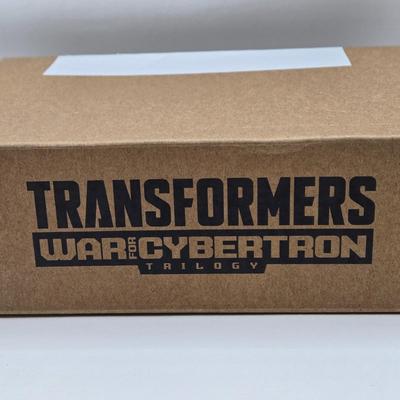 LOT 140: NIB Transformers Alternate Universe Optimus Prime and War for Cybertron Trilogy Bug Bite
