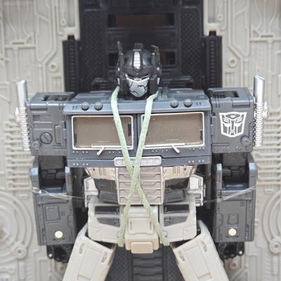 LOT 140: NIB Transformers Alternate Universe Optimus Prime and War for Cybertron Trilogy Bug Bite