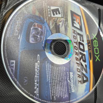 LOT 157: Large Variety of XBox Games Including The Sims, Legends of Wrestling II and More