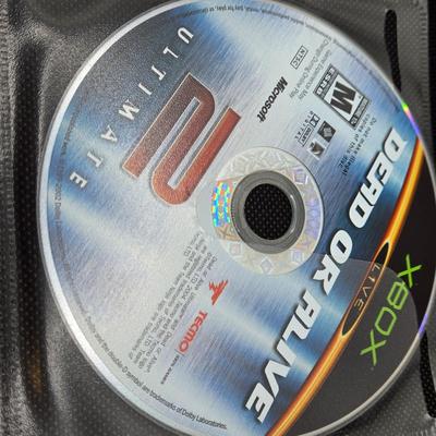 LOT 157: Large Variety of XBox Games Including The Sims, Legends of Wrestling II and More