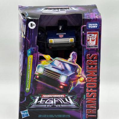 LOT 167: Transformers Legacy United Prime Universe Thundertron and Transformers Legacy Autobot Skids NIB