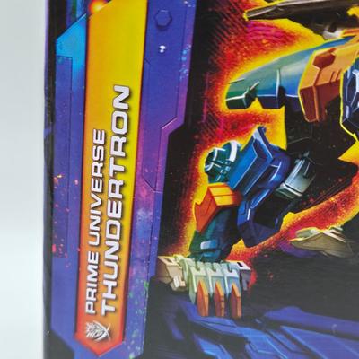 LOT 167: Transformers Legacy United Prime Universe Thundertron and Transformers Legacy Autobot Skids NIB