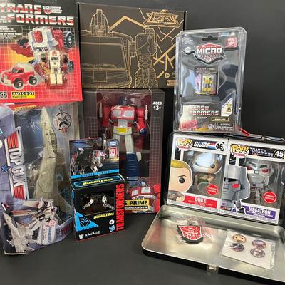 LOT 190: Big Lot of Transformers Toys and Collectibles, Top Gun Maverick, Funko GI Joe Crossover Lunchbox Set and More