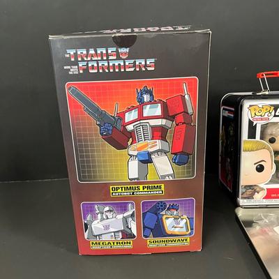 LOT 190: Big Lot of Transformers Toys and Collectibles, Top Gun Maverick, Funko GI Joe Crossover Lunchbox Set and More