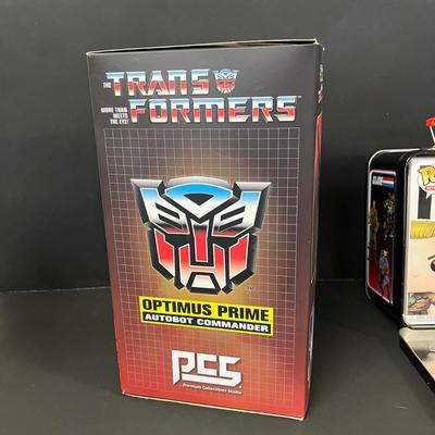 LOT 190: Big Lot of Transformers Toys and Collectibles, Top Gun Maverick, Funko GI Joe Crossover Lunchbox Set and More