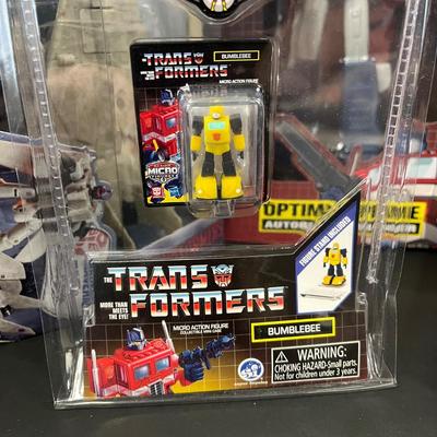 LOT 190: Big Lot of Transformers Toys and Collectibles, Top Gun Maverick, Funko GI Joe Crossover Lunchbox Set and More