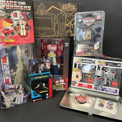 LOT 190: Big Lot of Transformers Toys and Collectibles, Top Gun Maverick, Funko GI Joe Crossover Lunchbox Set and More
