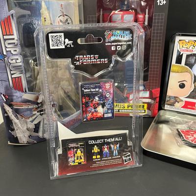LOT 190: Big Lot of Transformers Toys and Collectibles, Top Gun Maverick, Funko GI Joe Crossover Lunchbox Set and More