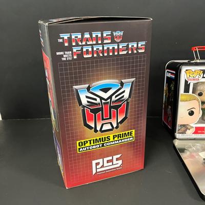LOT 190: Big Lot of Transformers Toys and Collectibles, Top Gun Maverick, Funko GI Joe Crossover Lunchbox Set and More