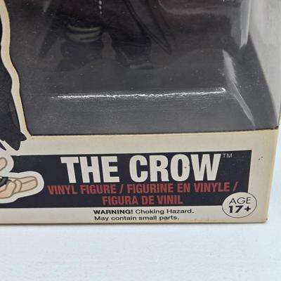 LOT 192: Variety of Funko Pops NIB Including Doc Holliday, Cocaine Bear, and The Crow