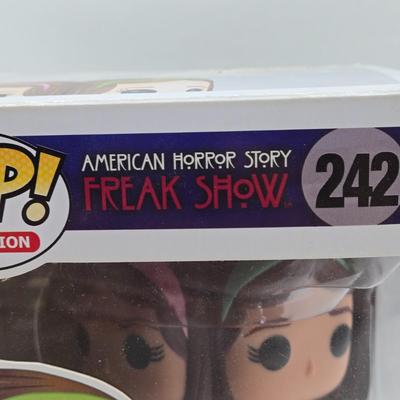 LOT 192: Variety of Funko Pops NIB Including Doc Holliday, Cocaine Bear, and The Crow