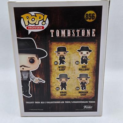 LOT 192: Variety of Funko Pops NIB Including Doc Holliday, Cocaine Bear, and The Crow