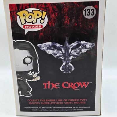 LOT 192: Variety of Funko Pops NIB Including Doc Holliday, Cocaine Bear, and The Crow