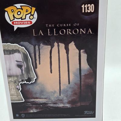 LOT 192: Variety of Funko Pops NIB Including Doc Holliday, Cocaine Bear, and The Crow