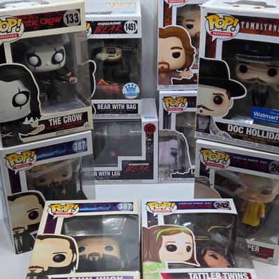 LOT 192: Variety of Funko Pops NIB Including Doc Holliday, Cocaine Bear, and The Crow