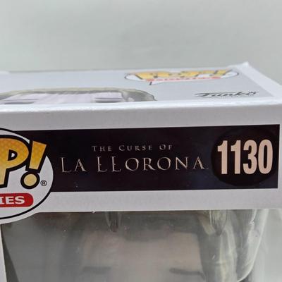 LOT 192: Variety of Funko Pops NIB Including Doc Holliday, Cocaine Bear, and The Crow