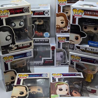 LOT 192: Variety of Funko Pops NIB Including Doc Holliday, Cocaine Bear, and The Crow