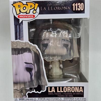 LOT 192: Variety of Funko Pops NIB Including Doc Holliday, Cocaine Bear, and The Crow