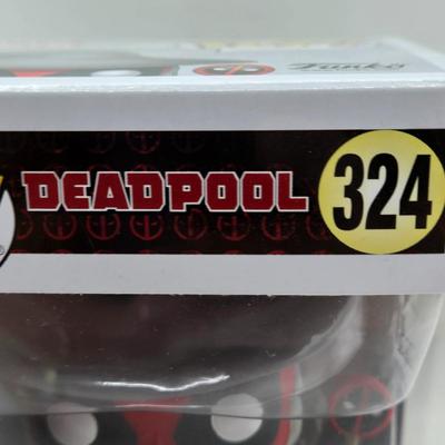 LOT 193: NIB Variety of Funko Pops Including Wizard Deadpool, Halo the Weapon, and Super Heroes Batgirl