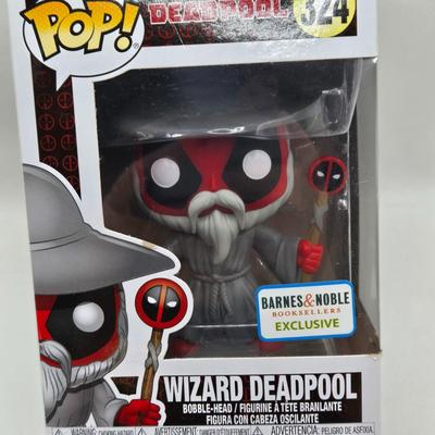 LOT 193: NIB Variety of Funko Pops Including Wizard Deadpool, Halo the Weapon, and Super Heroes Batgirl