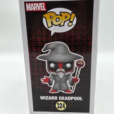 LOT 193: NIB Variety of Funko Pops Including Wizard Deadpool, Halo the Weapon, and Super Heroes Batgirl