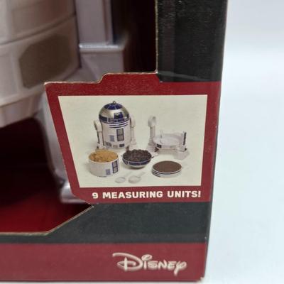 LOT 194: NIB Star Wars Funko Pops Including The Bad Batch Set and 2 Iden Versio, R2-D2 Measuring Cup Set, and Millennium Falcon...