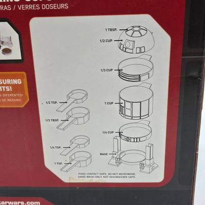 LOT 194: NIB Star Wars Funko Pops Including The Bad Batch Set and 2 Iden Versio, R2-D2 Measuring Cup Set, and Millennium Falcon...