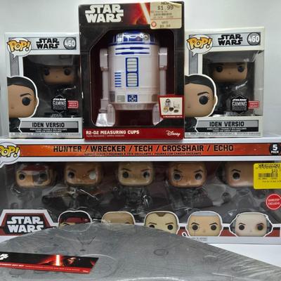 LOT 194: NIB Star Wars Funko Pops Including The Bad Batch Set and 2 Iden Versio, R2-D2 Measuring Cup Set, and Millennium Falcon...
