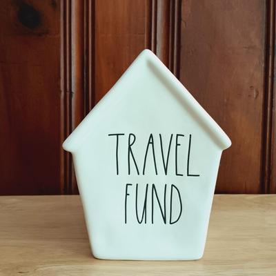 LOT 14: Contemporary Home Decor Including Crate & Barrel Vase, Rae Dunn Travel Fund Bank, and Scott Living Artificial Grass Plant and...